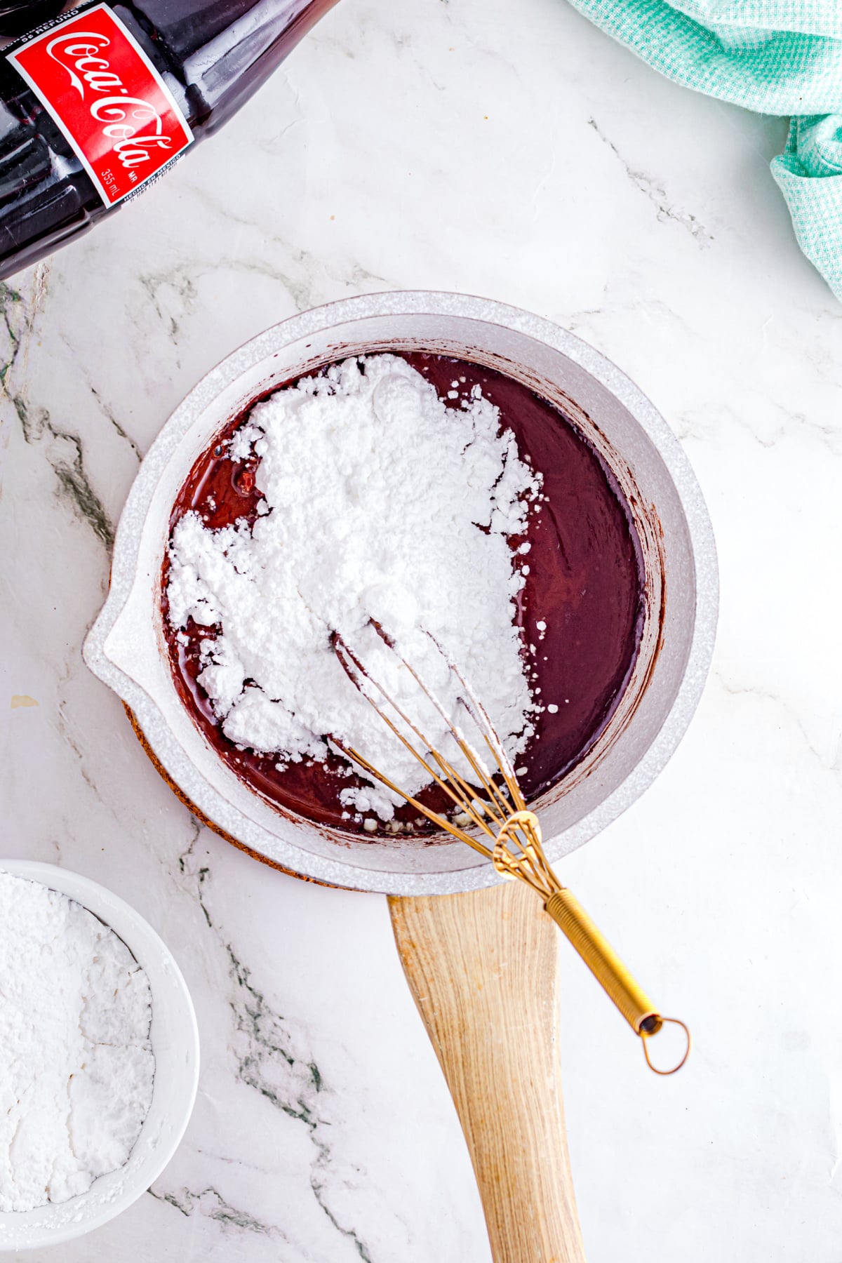 Soda, butter, and cocoa powder combined in a saucepan.