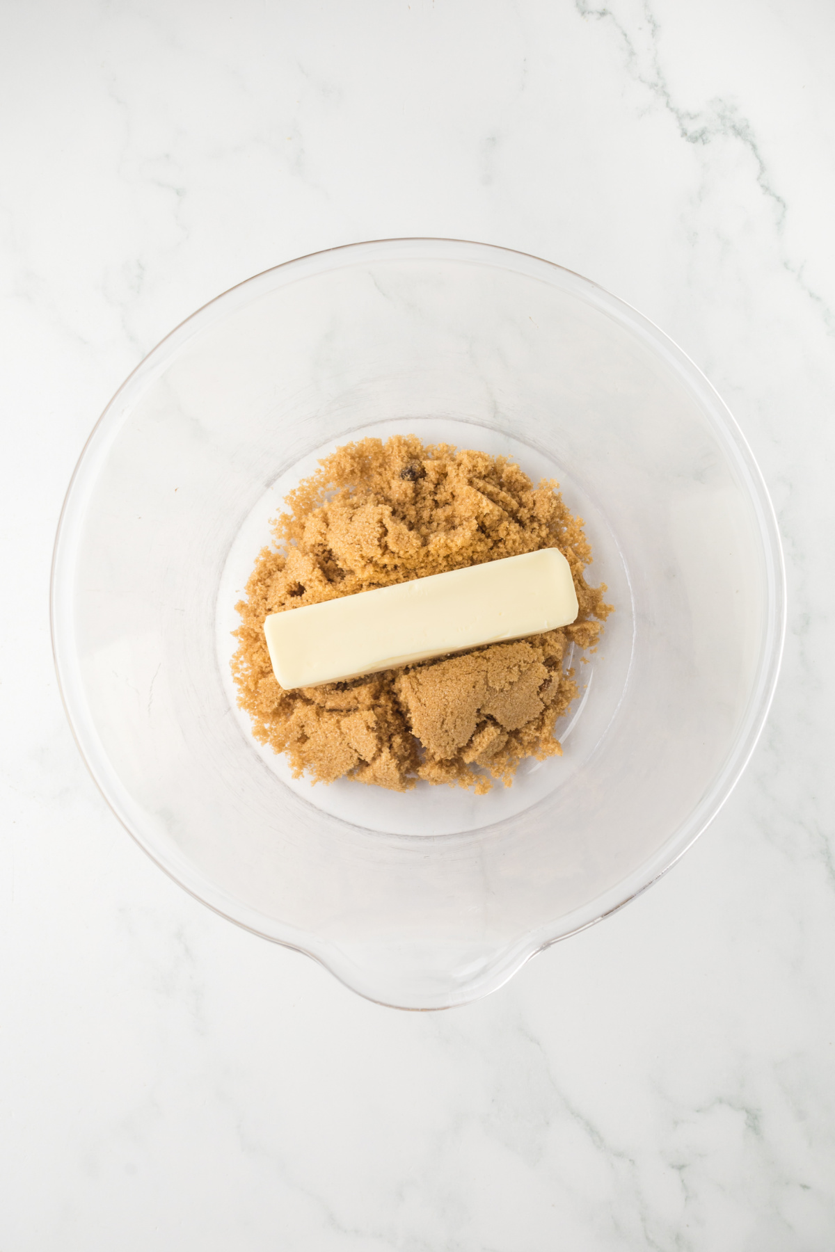 Softened butter and brown sugar in a mixing bowl.