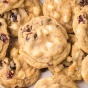 Cranberry white chocolate cookies piled on top of one another.