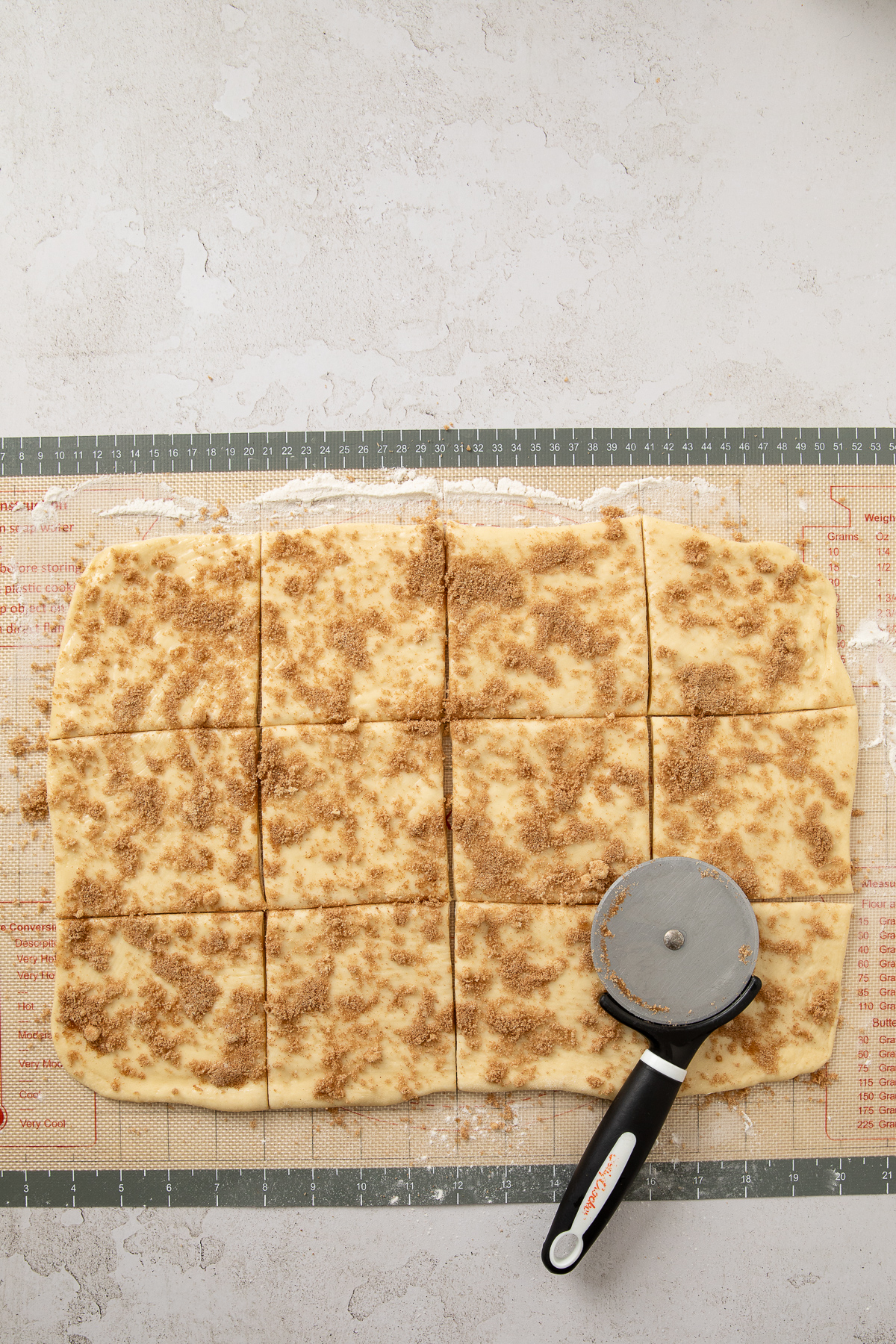 Cinnamon and brown sugar sprinkled over top of the dough.