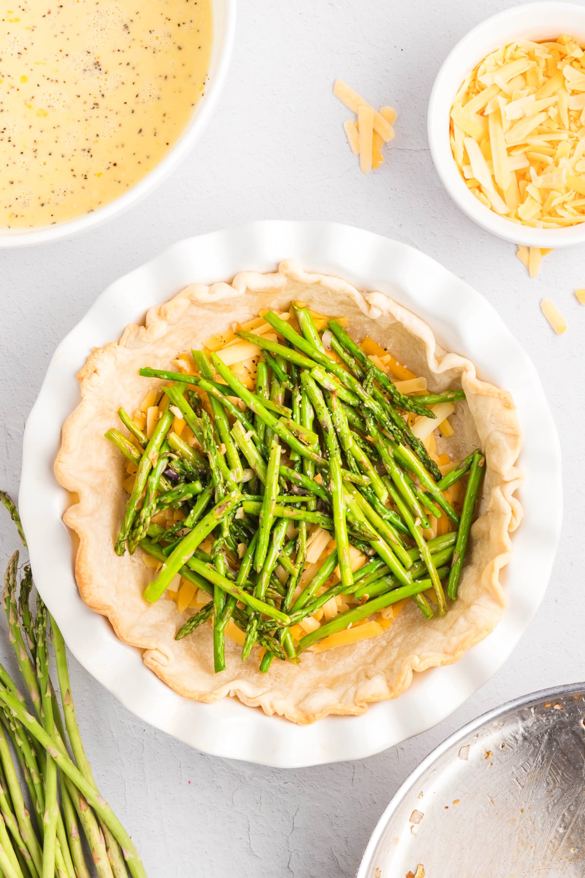 The asparagus mixture added to the pie crust.