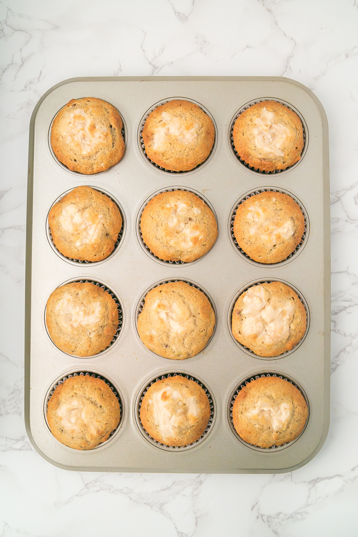 Baked muffins in pan right out of the oven.