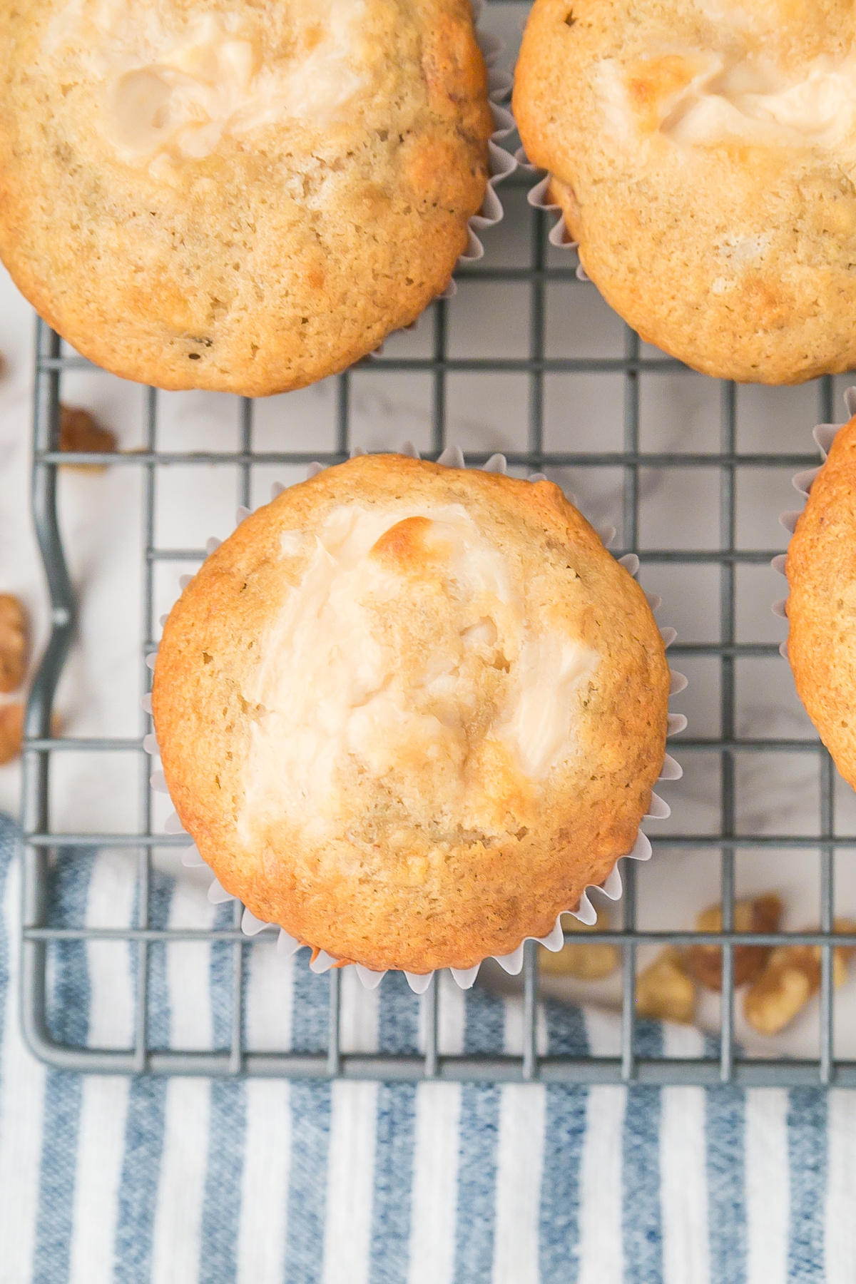 Muffins on a rack completely cooling.