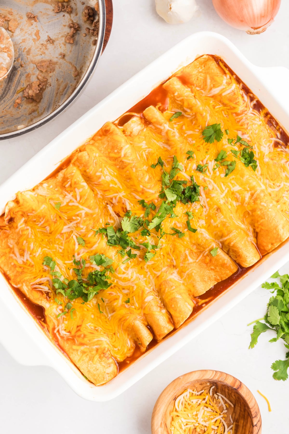 Beef and cheese enchiladas baked and cooling. 