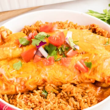 Ground beef enchiladas on a plate.