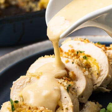 Stuffed chicken breast with stuffing on a plate.