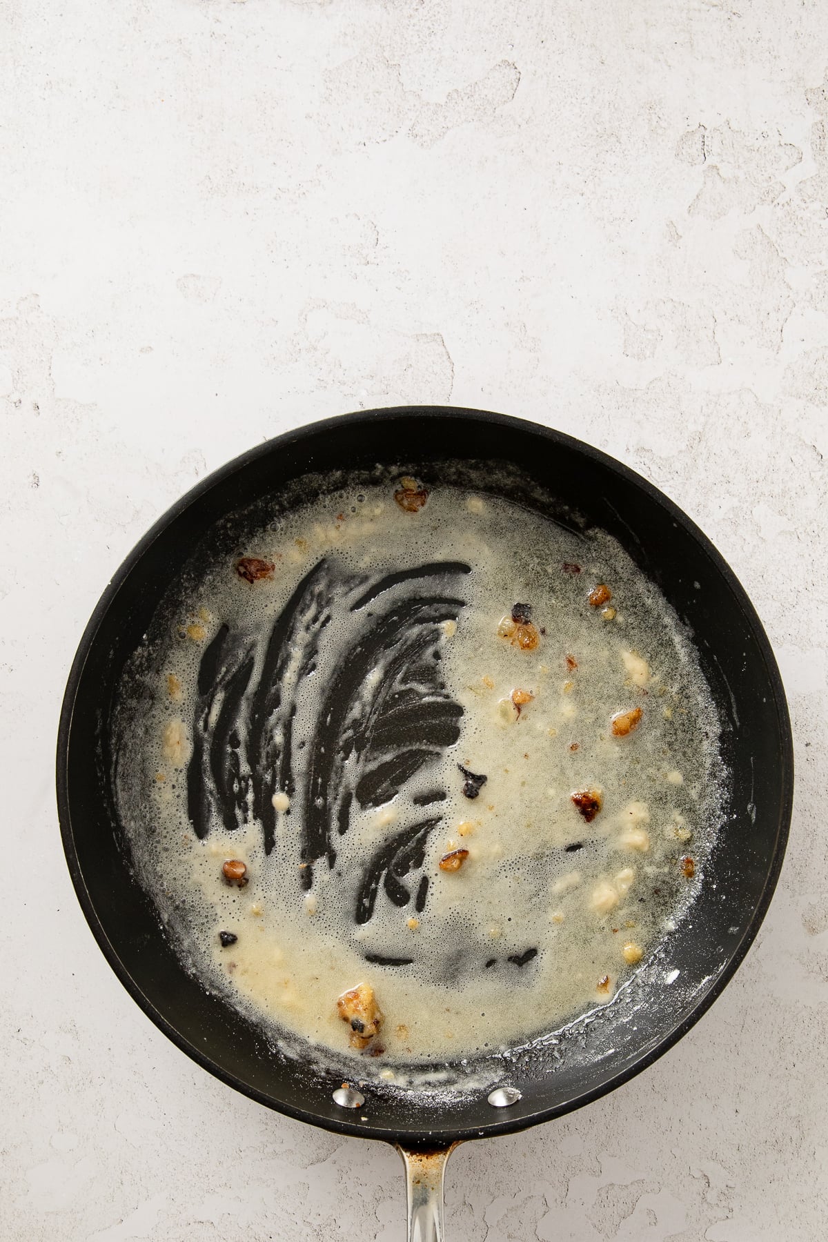 Butter and flour added to the skillet after chicken is removed.