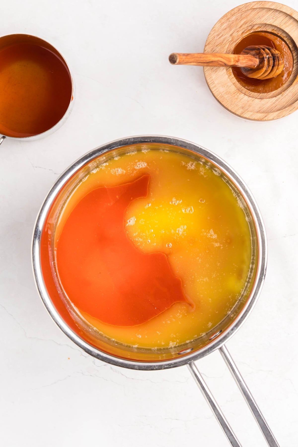 Melted butter with the buffalo sauce in a saucepan. 