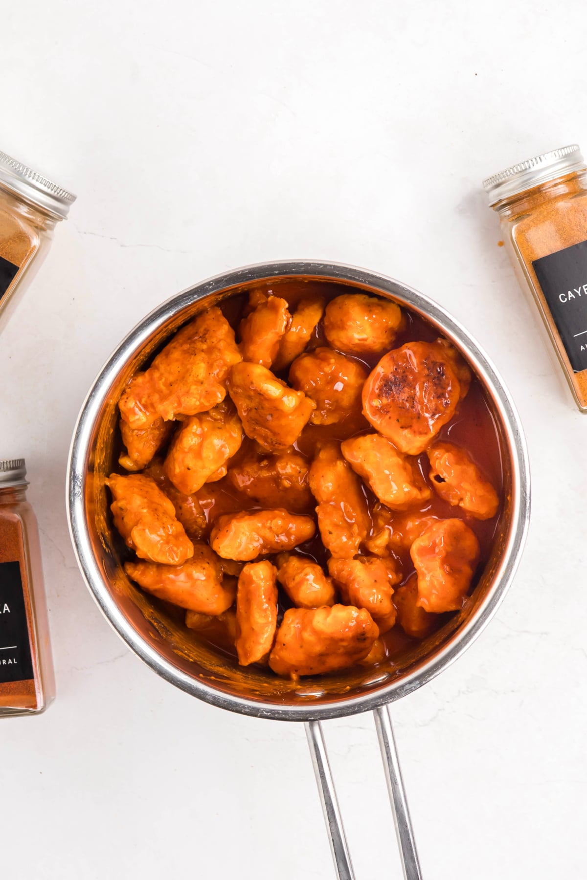 The chicken coated in the buffalo sauce to serve.