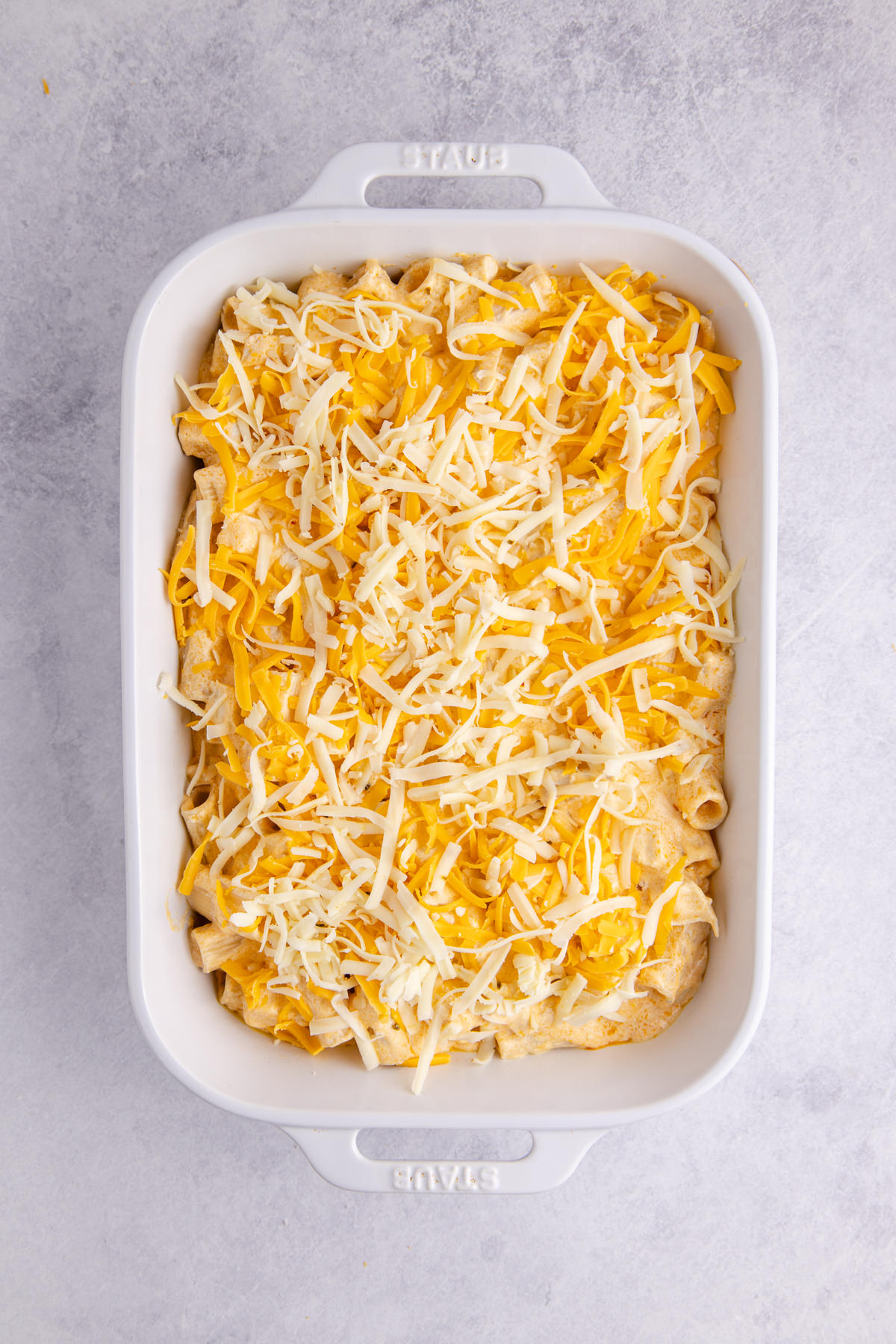 All the ingredients added to a casserole dish.