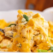 Buffalo chicken casserole being scooped out of the dish.