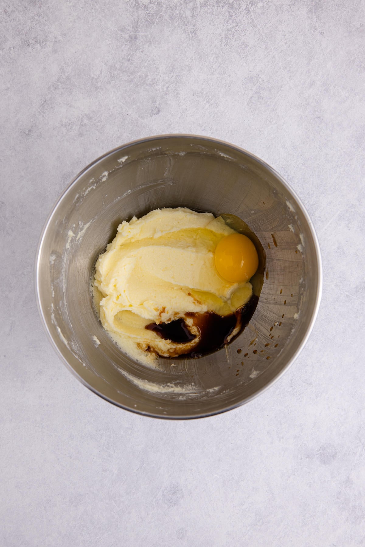 Butter, egg and sugar combined to the bowl.