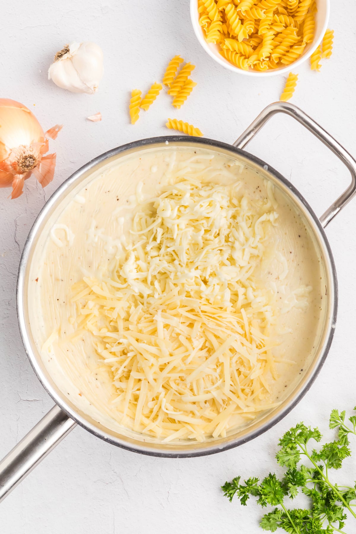 Milk, cream, and spices in a pan.