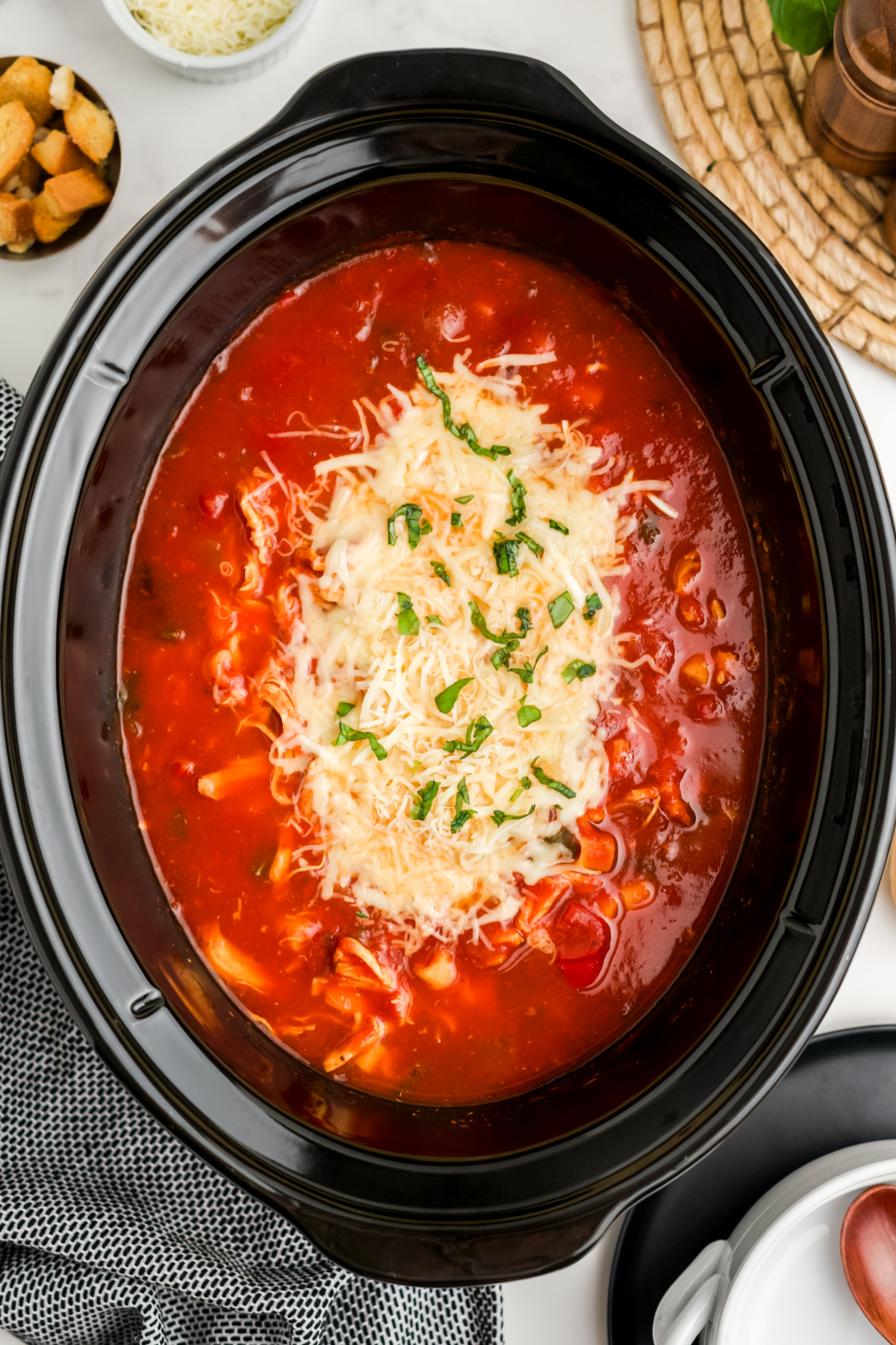 Mozzarella and parmesan cheese added to the crockpot.