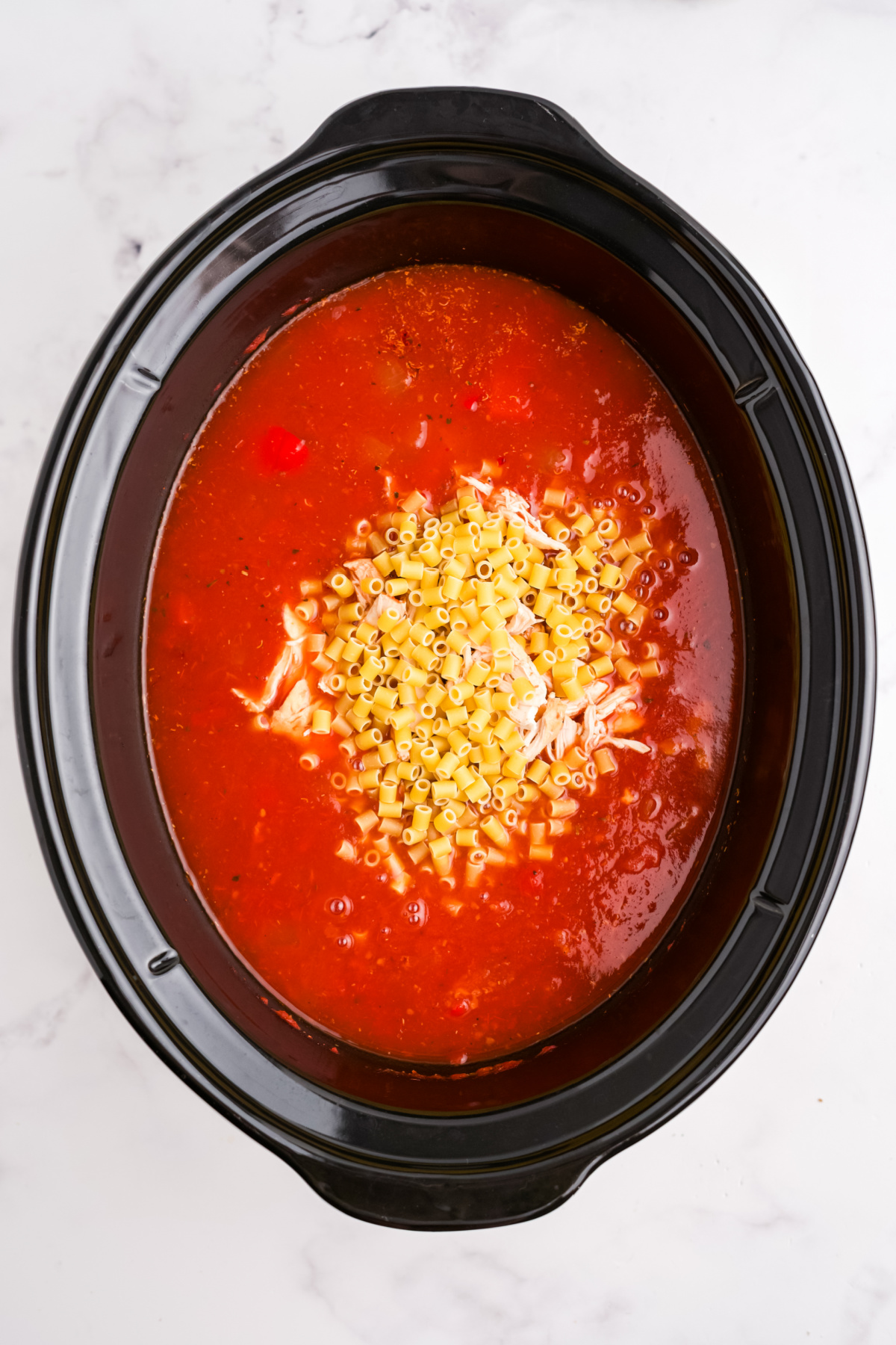 Ditalini pasta added to the soup.