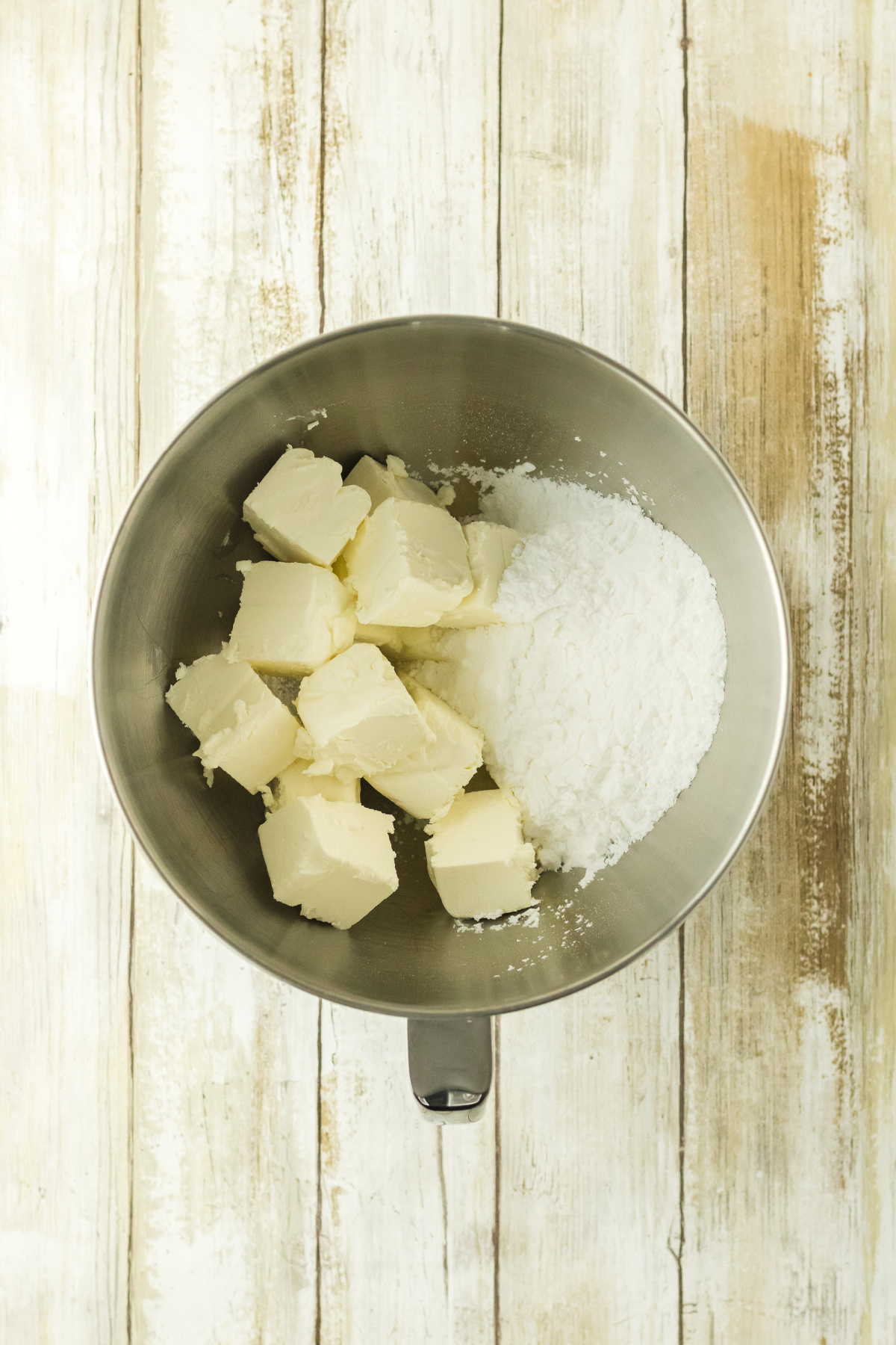Butter and sugar mixed in a bowl.