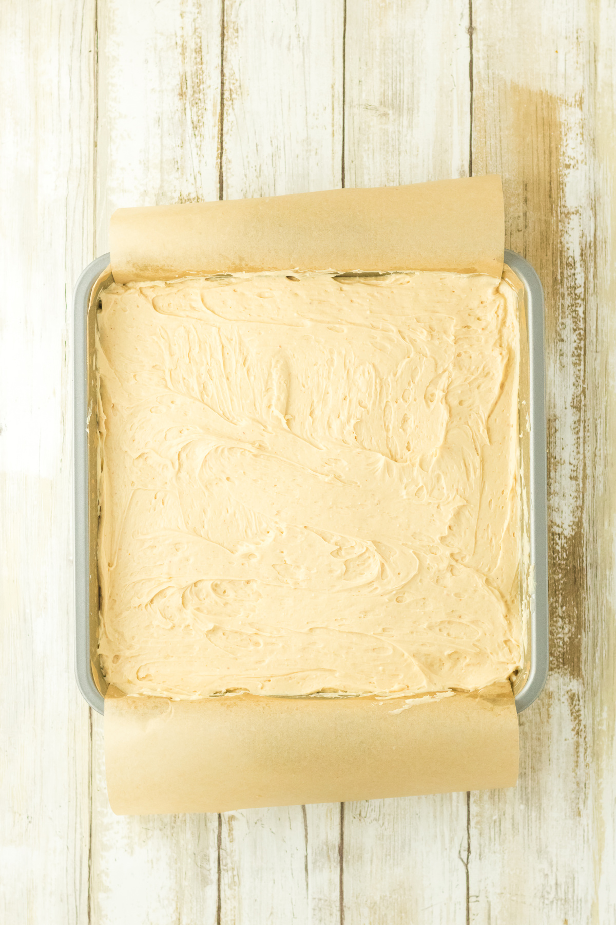 The cheesecake mixture spread over the pressed crust.