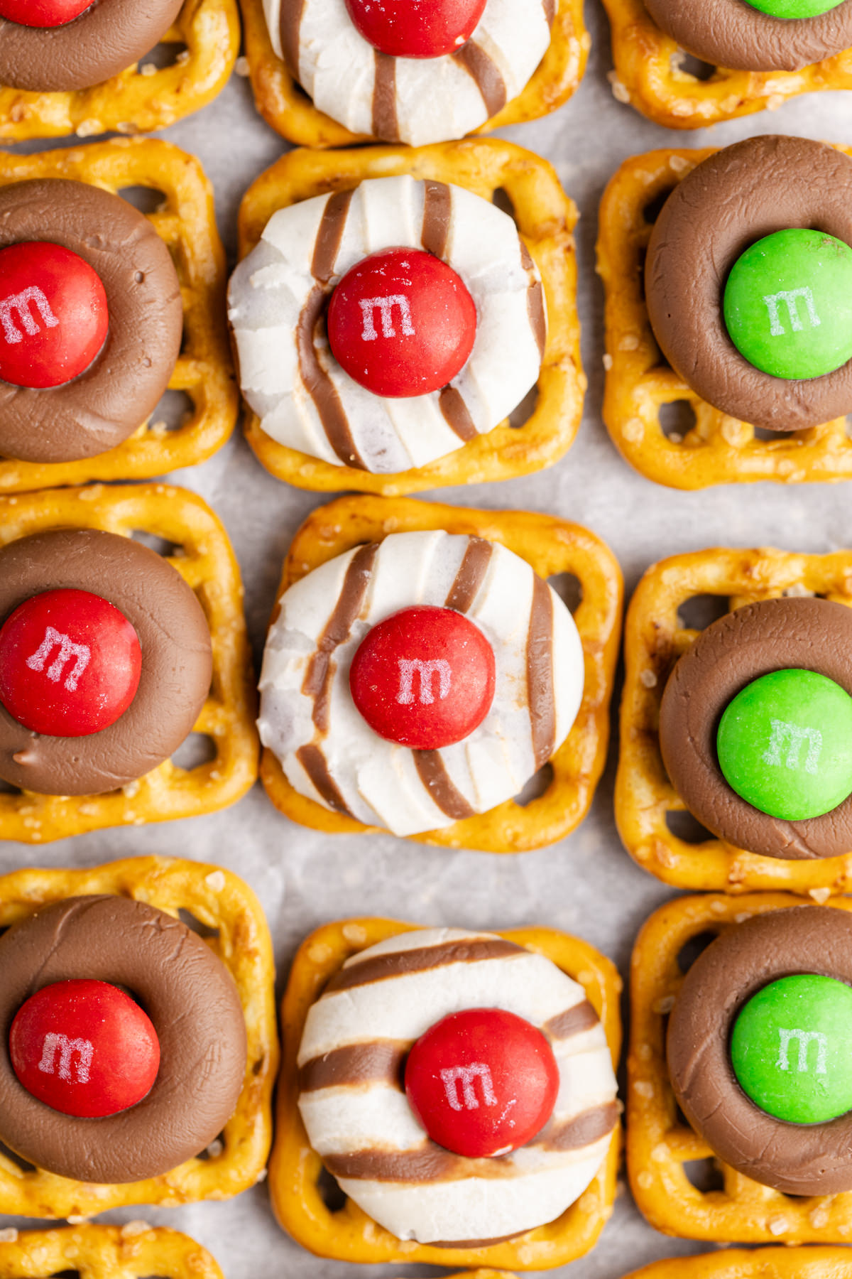 M&Ms and chocolate on top of a pretzels.