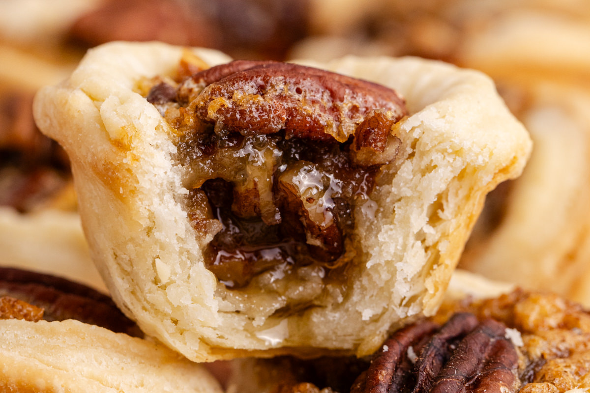 Close-up of pecan tart with a bite out of it