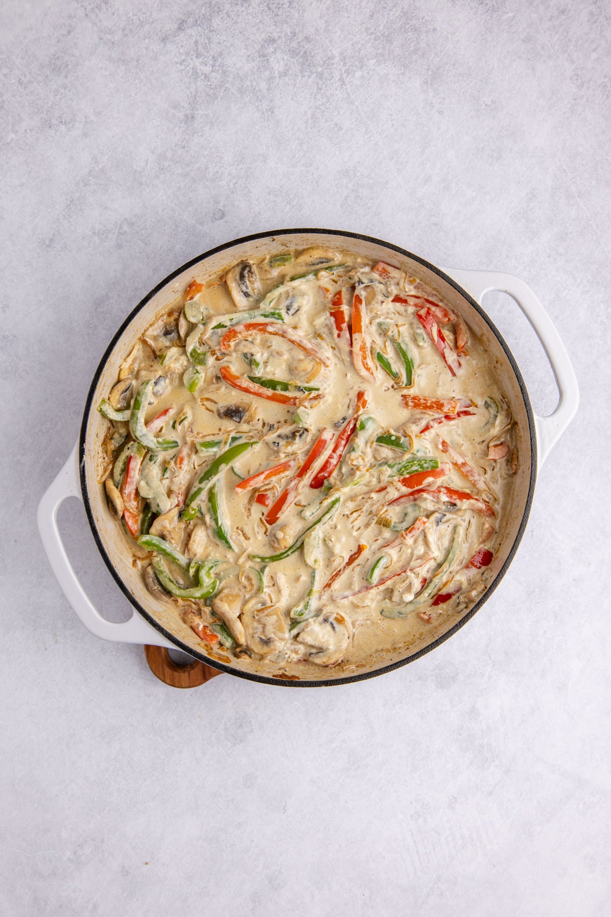 Cream cheese melting in the skillet.