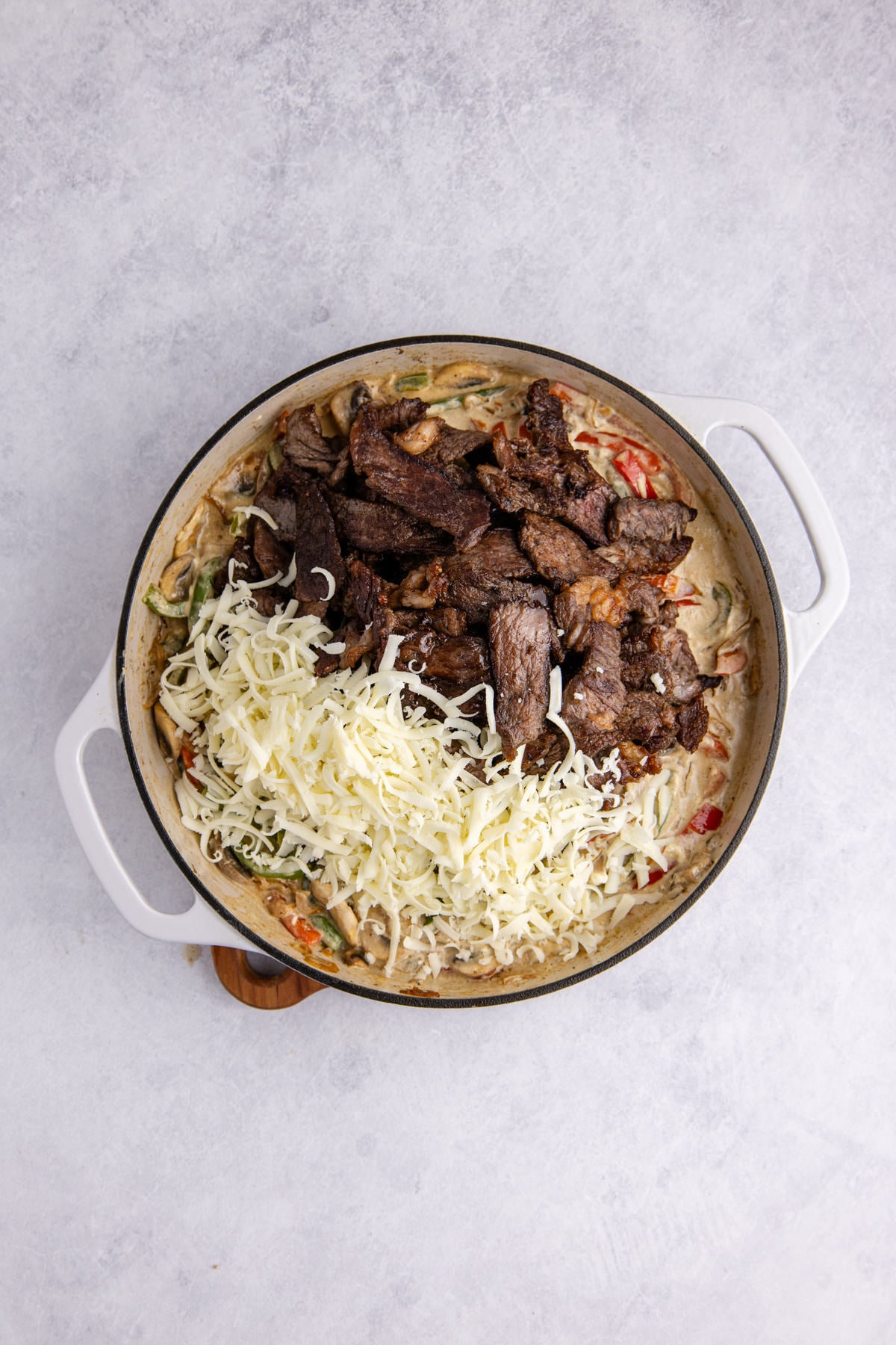 Meat added back to the skillet.