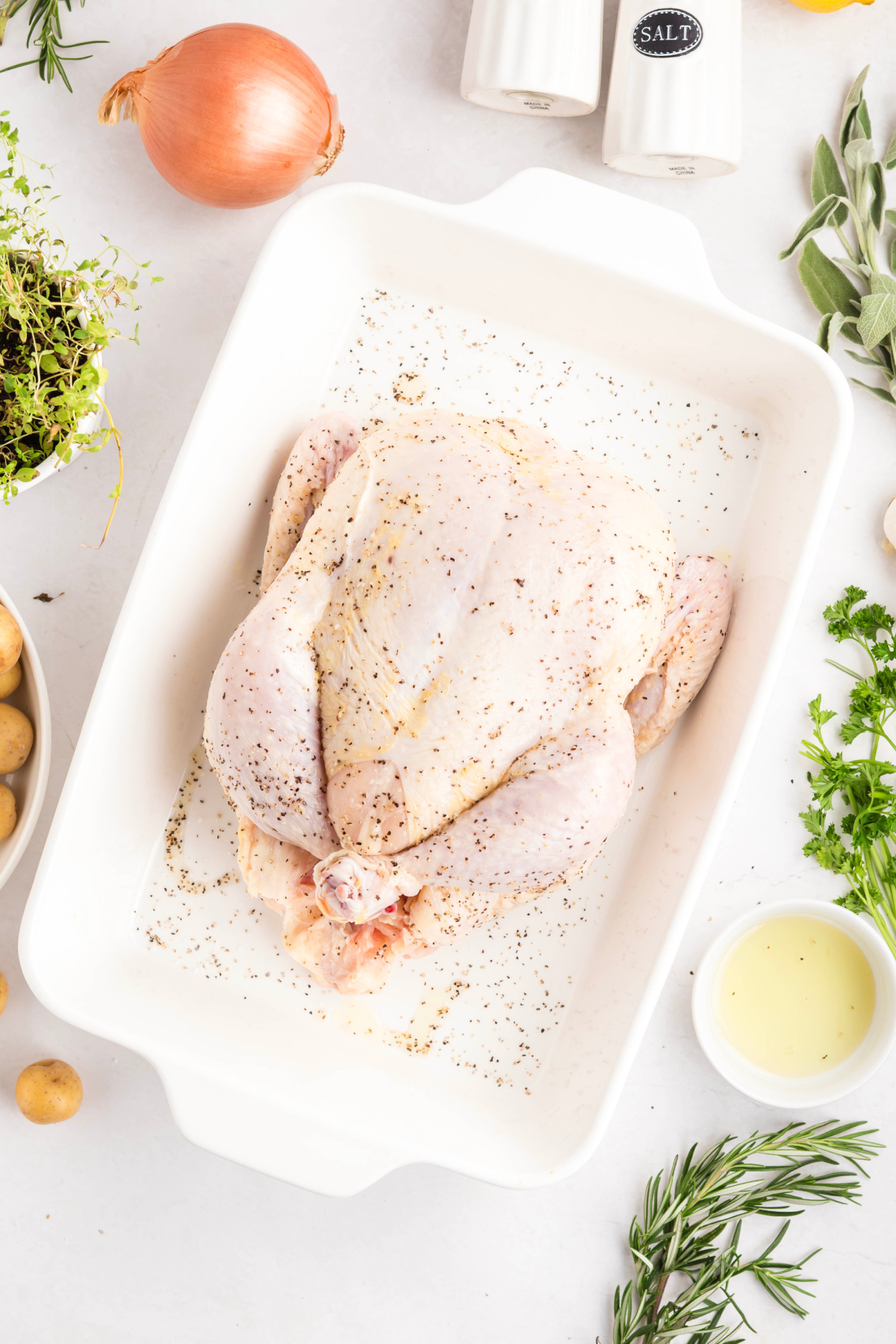 Oil, salt and pepper sprinkled on the outside of the chicken