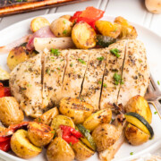 Sheet pan chicken breasts on a plate.