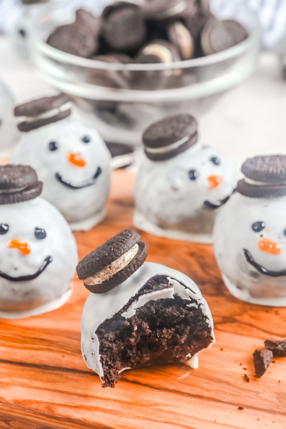 An Oreo ball eaten on a cutting board.