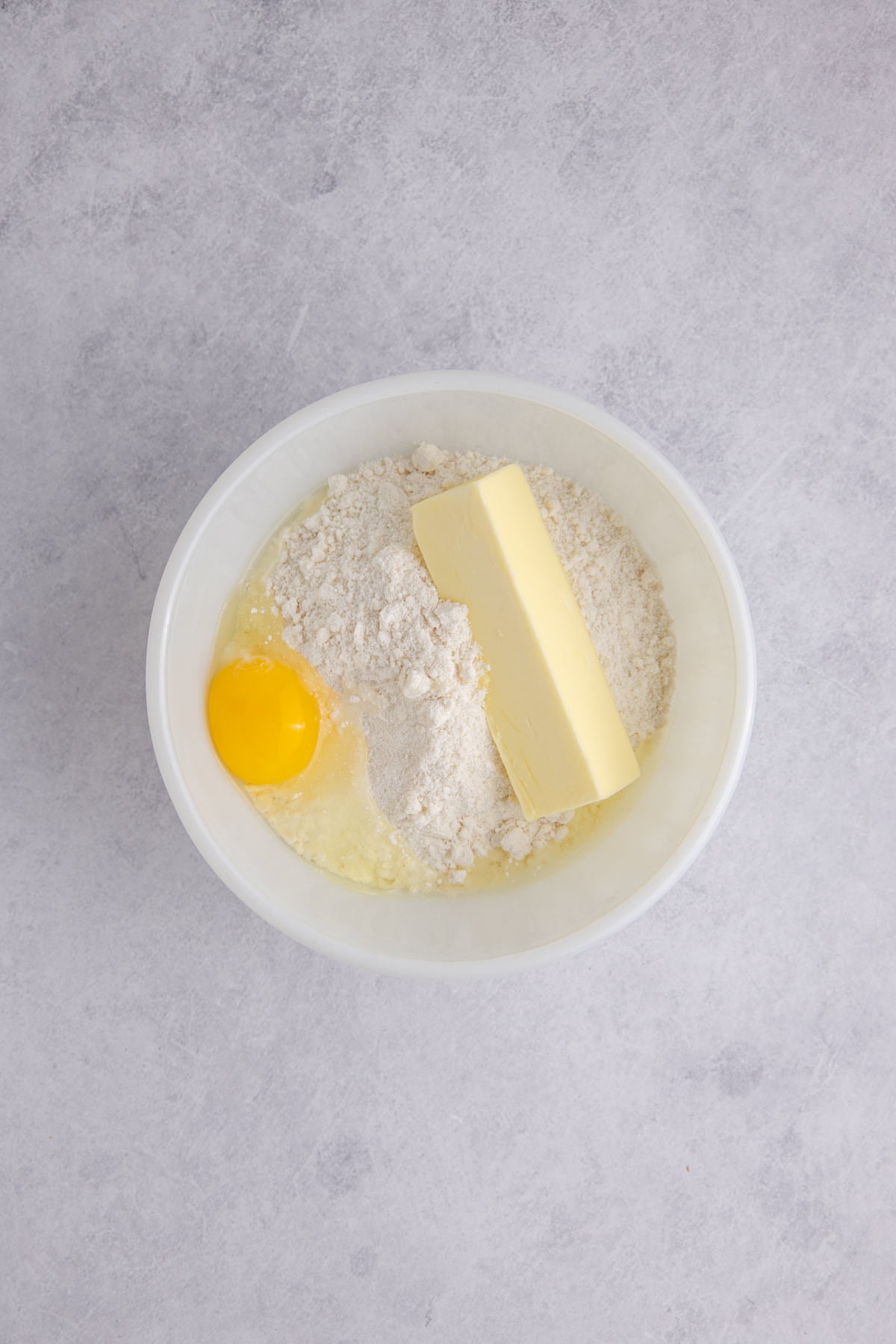 Butter and egg with the sugar cookie mix in a large mixing bowl.