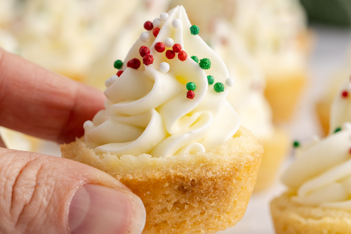 A cookie cup held in the air.