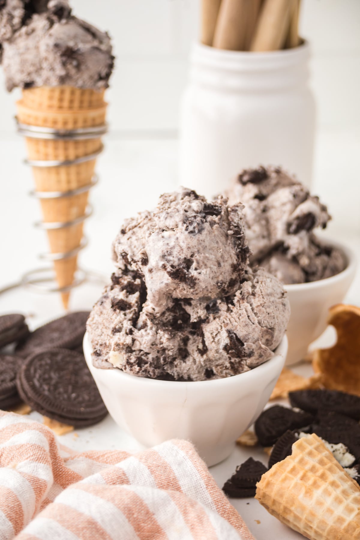 Two bowls full of Ice Cream on a table.