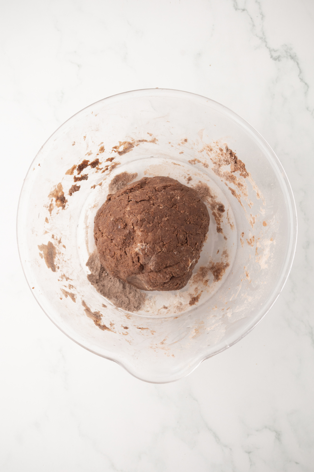 The ball of dough in the bowl.