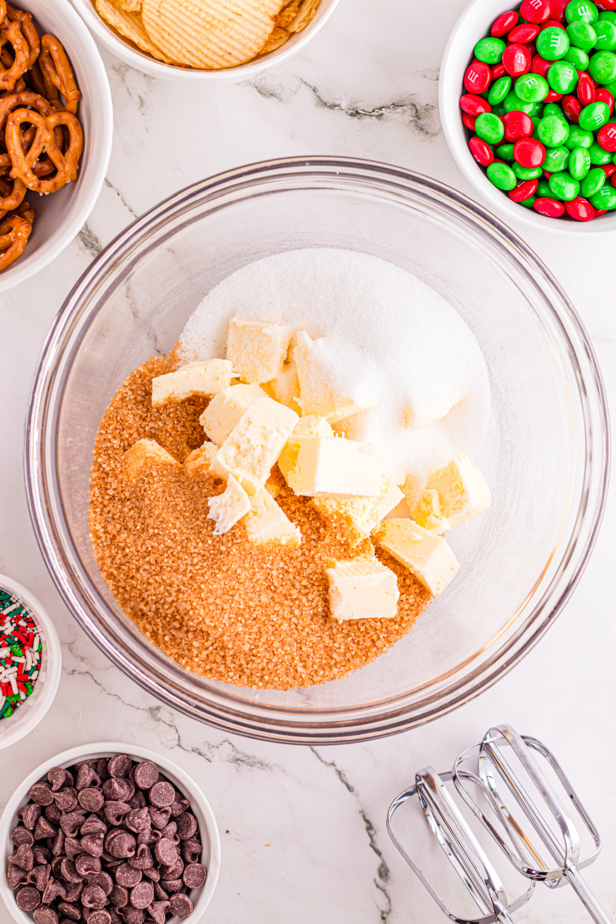 Butter mixed with the brown and white sugar in a bowl.