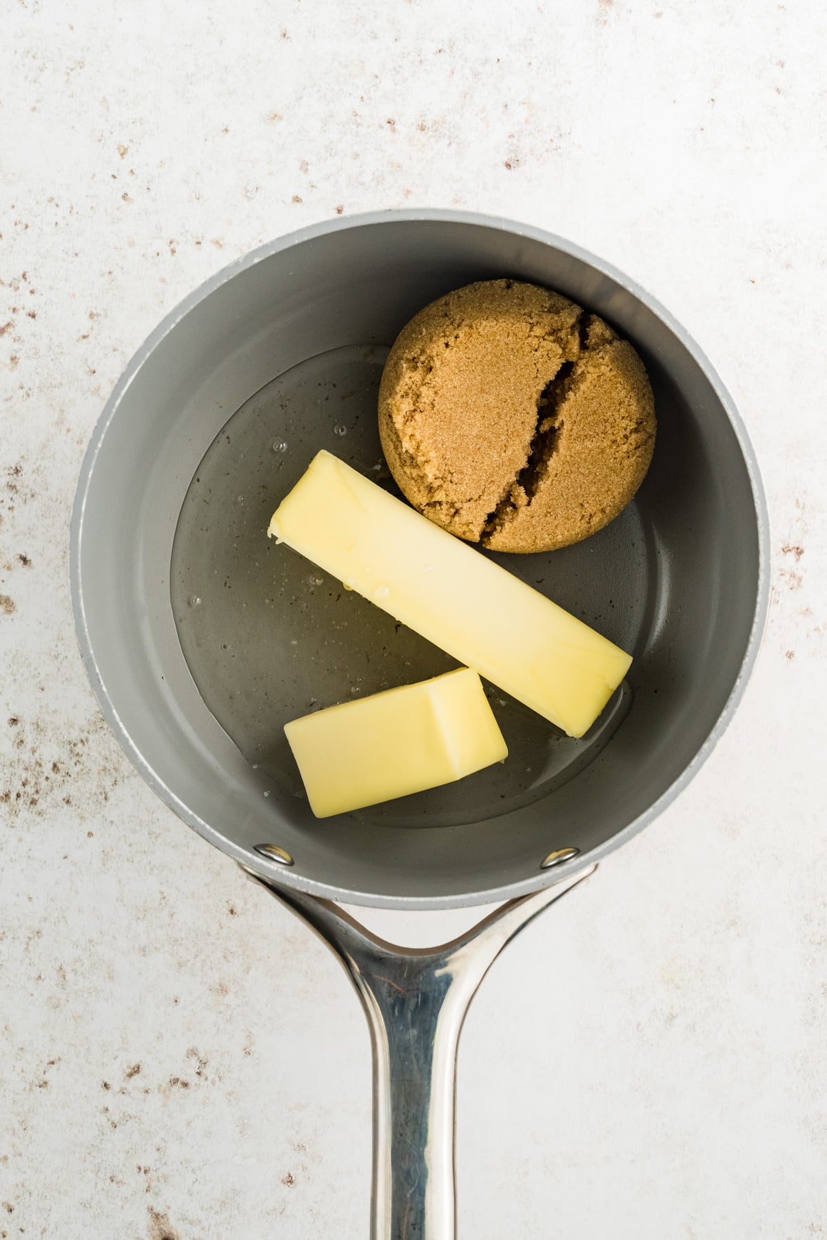 Butter, brown sugar, and corn syrup in a saucepan.
