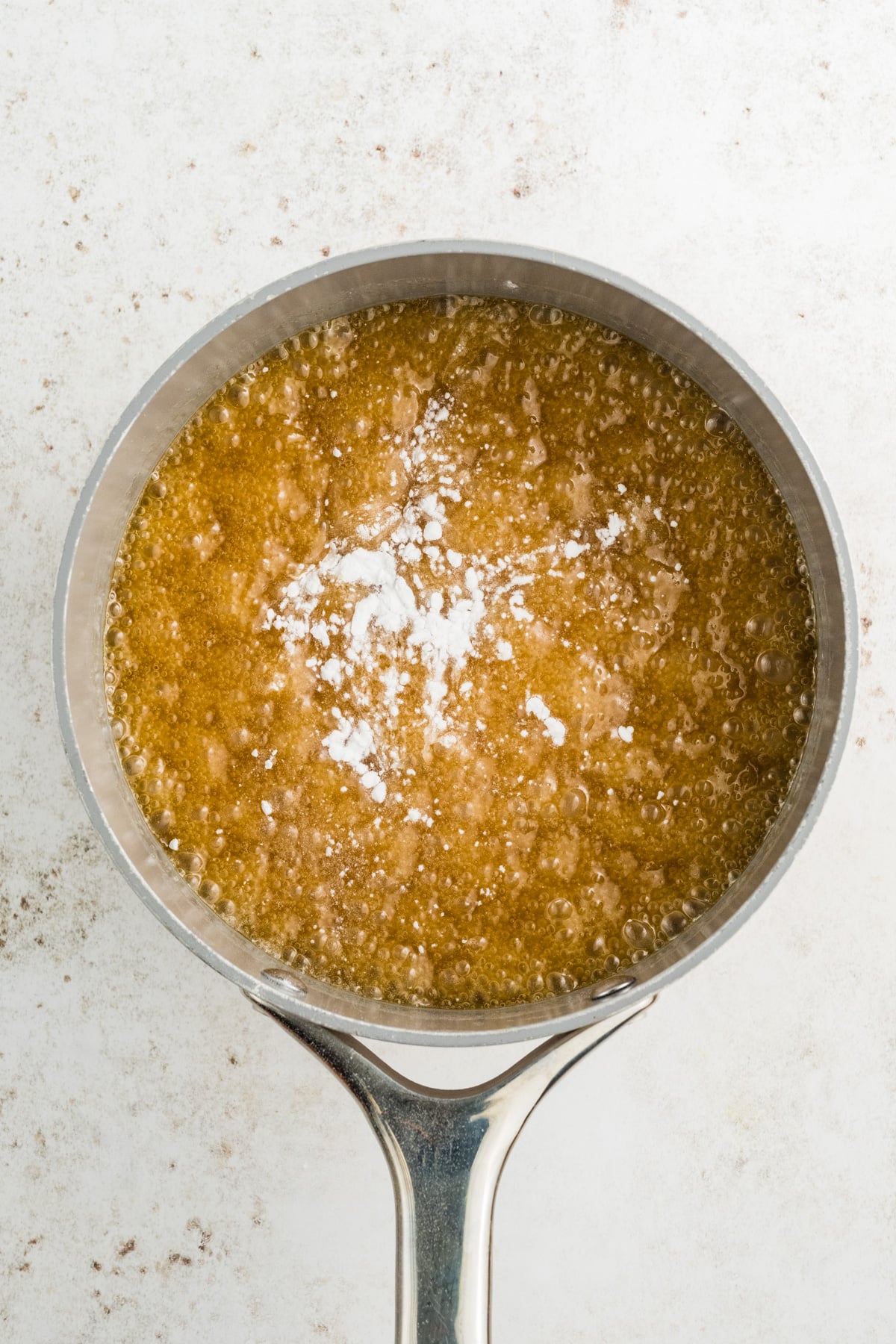 Vanilla, baking soda, and salt added to the boiled mixture.