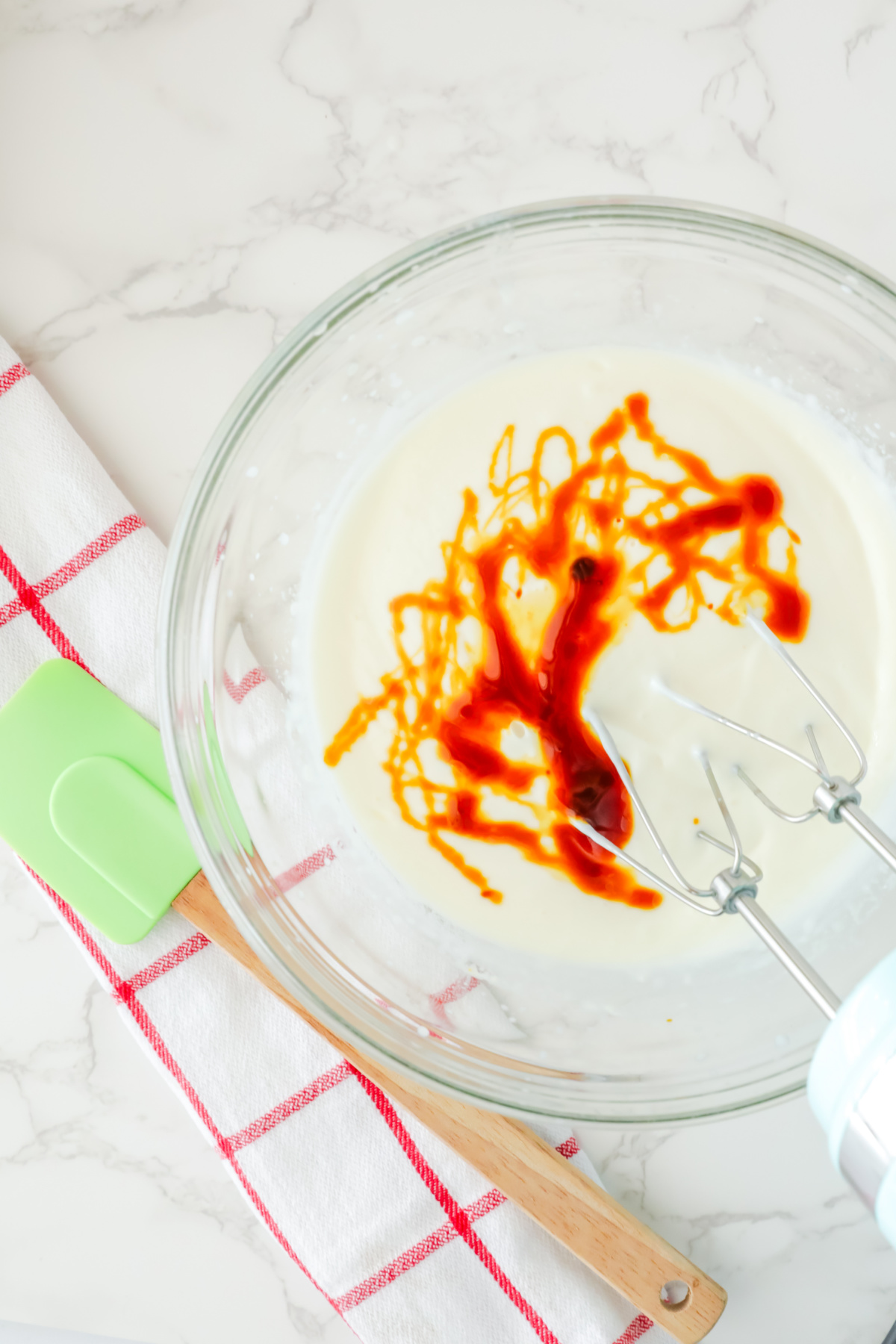 Molasses and vanilla extract added to the bowl.