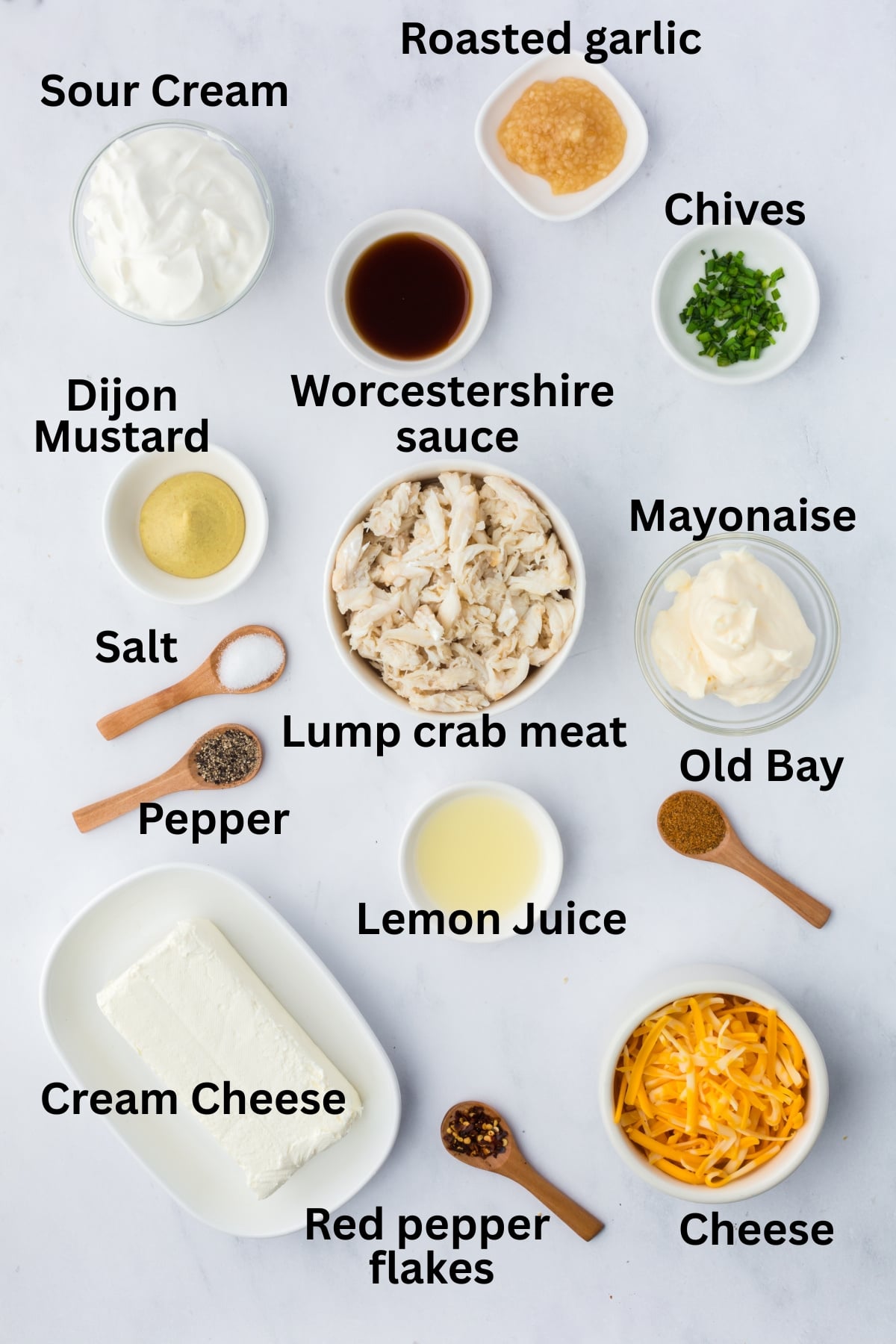 Ingredients to make this dip in bowls on a table.