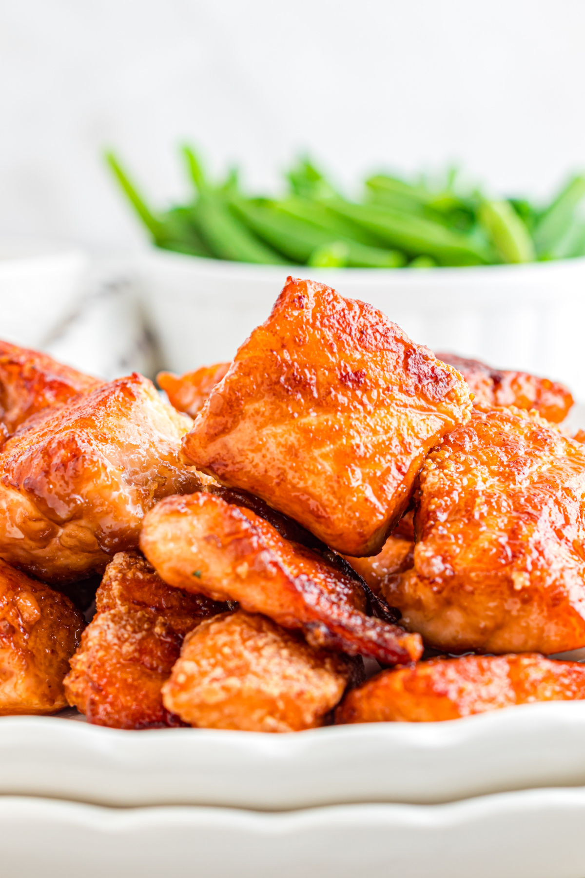 Crispy salmon pieces stacked on a plate.
