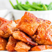Crispy salmon bites stacked on a plate.