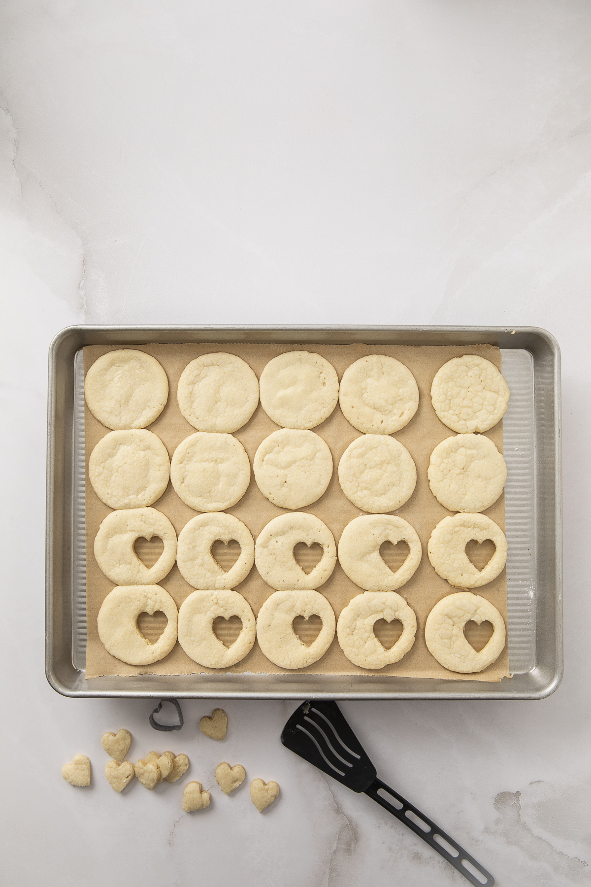 A small heart shape cut out of half of the cookies.
