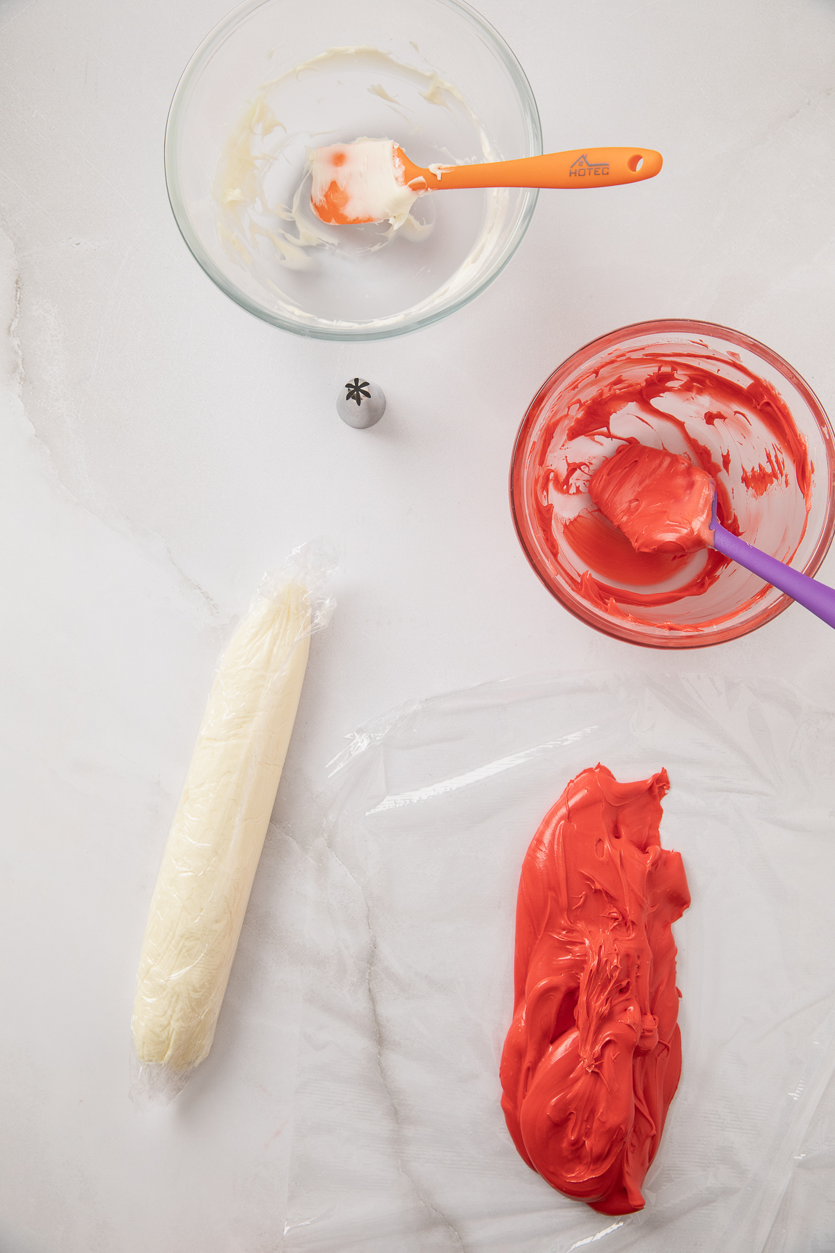 Logs of frosting wrapped into piping bags.