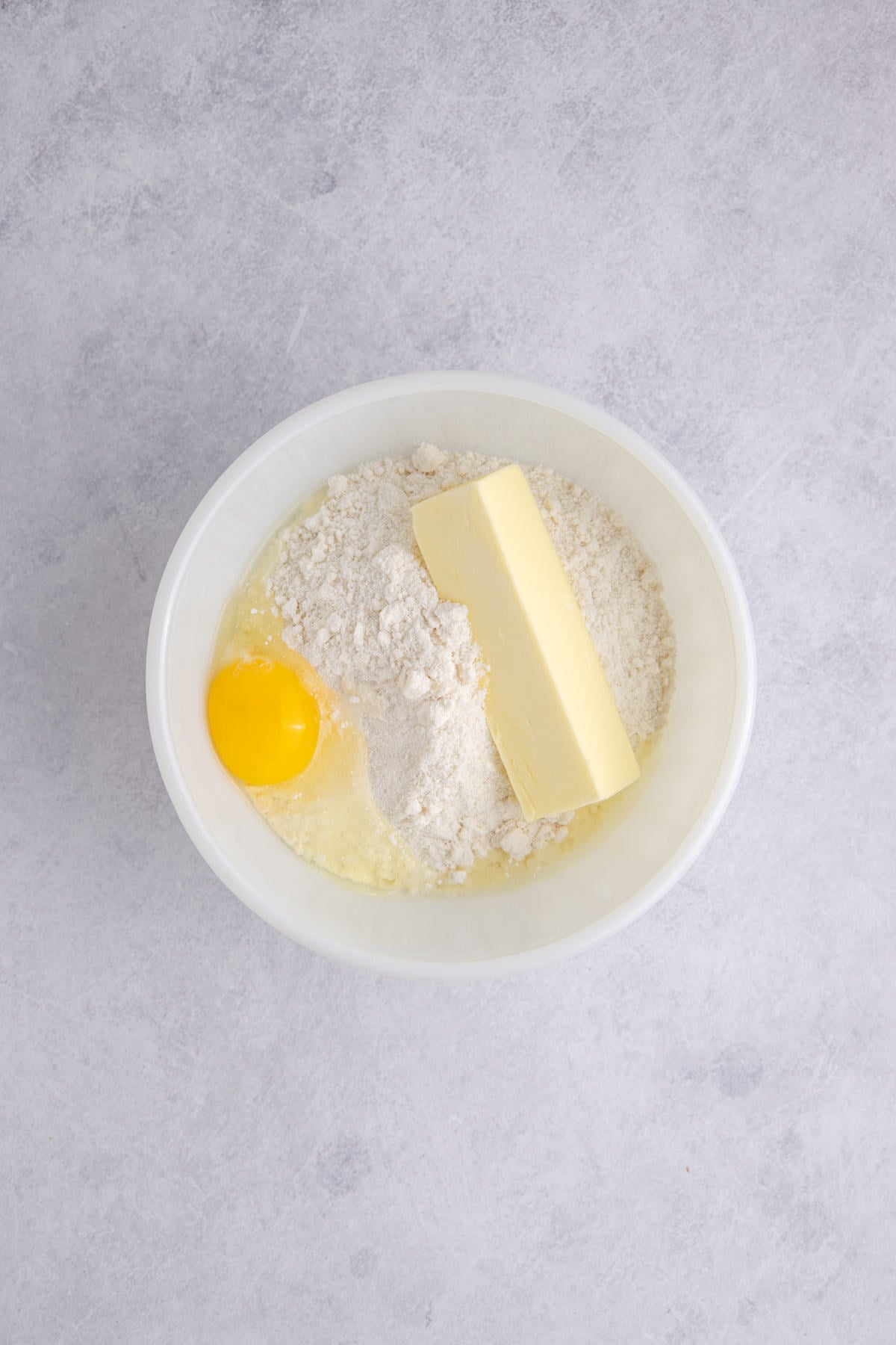 Cookie mix, butter, and a egg in a large mixing bowl.