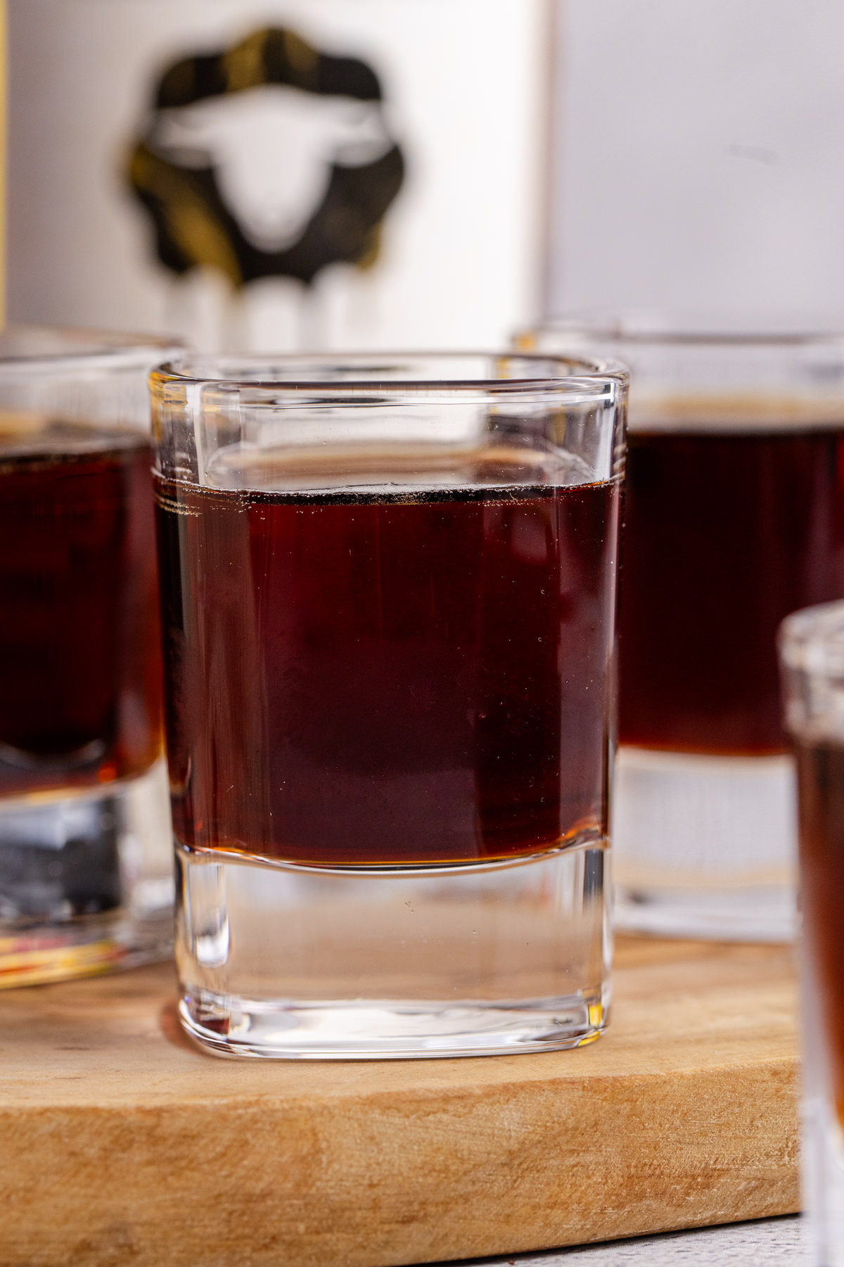 A few shooters on a cutting board.
