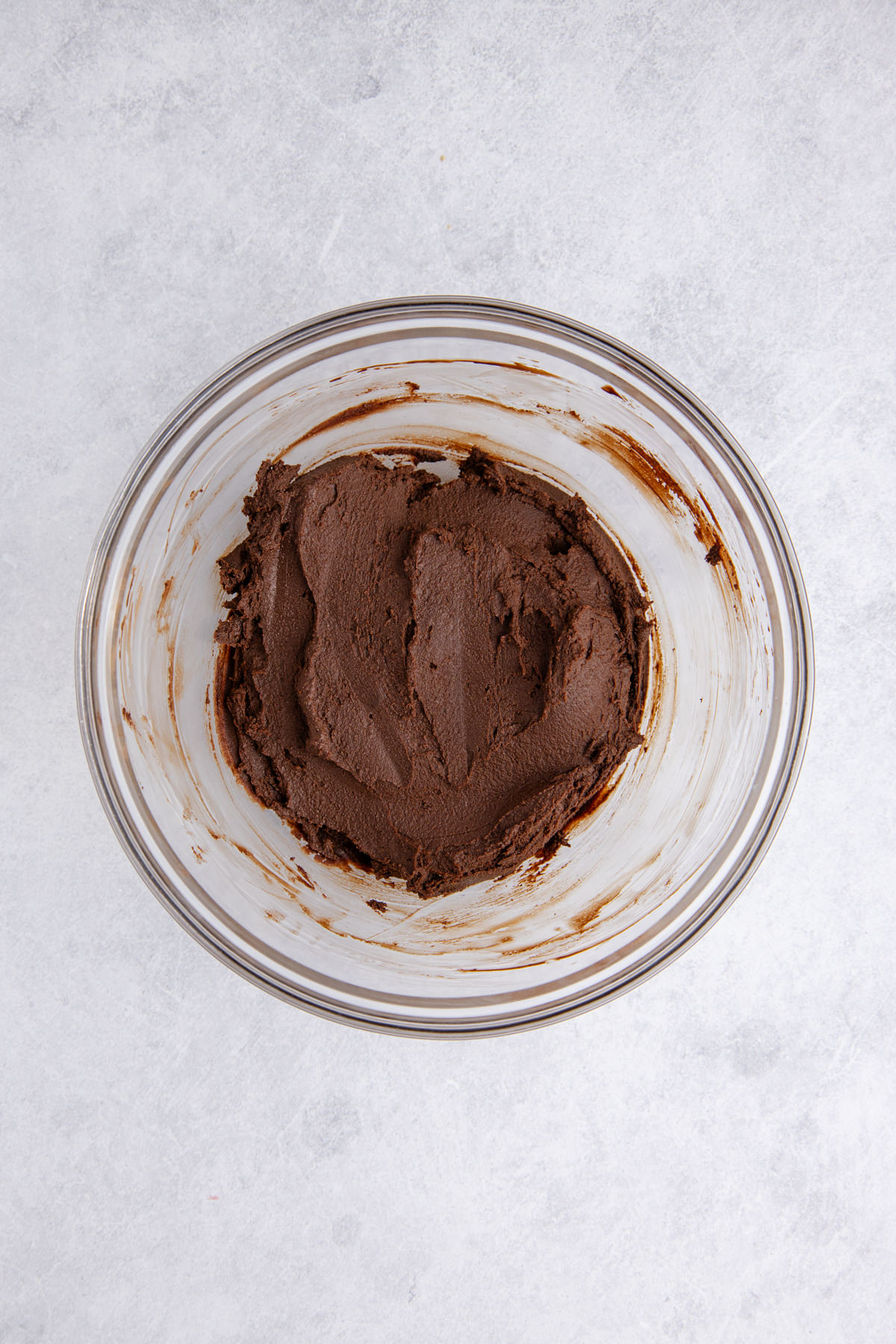 Chocolate and cream mixed in a large bowl.