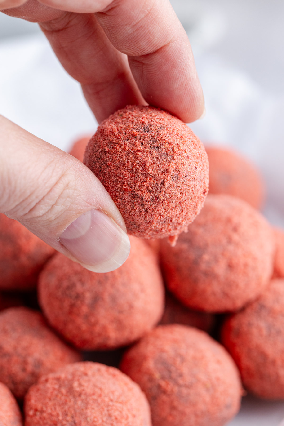 A truffle being held up in the air.