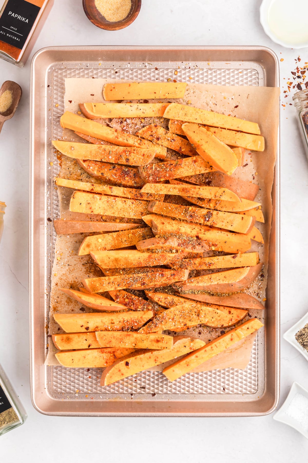 Sweet potatoes on a sheet pan.