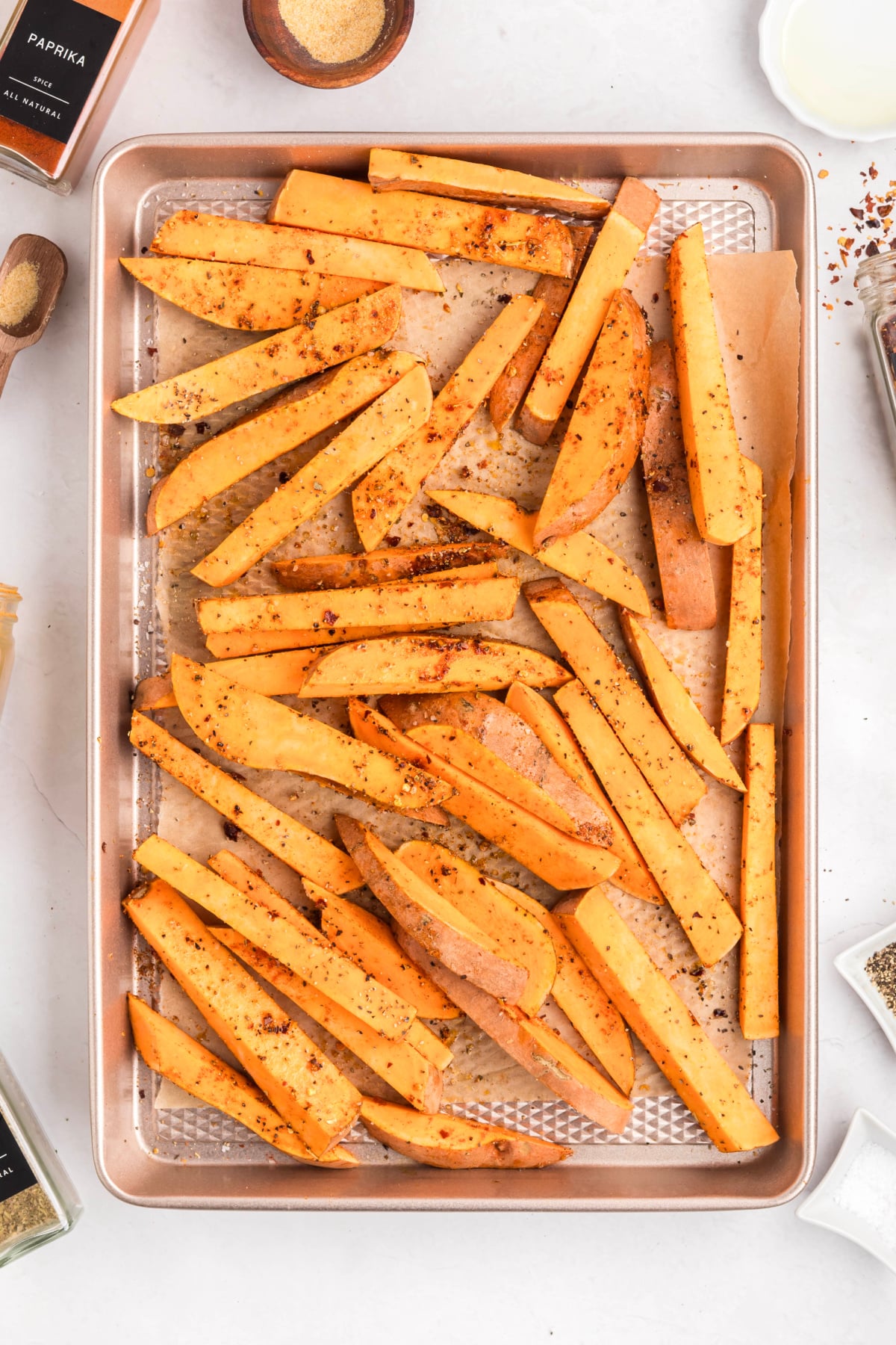 Oil and seasoning added to the sweet potatoes.