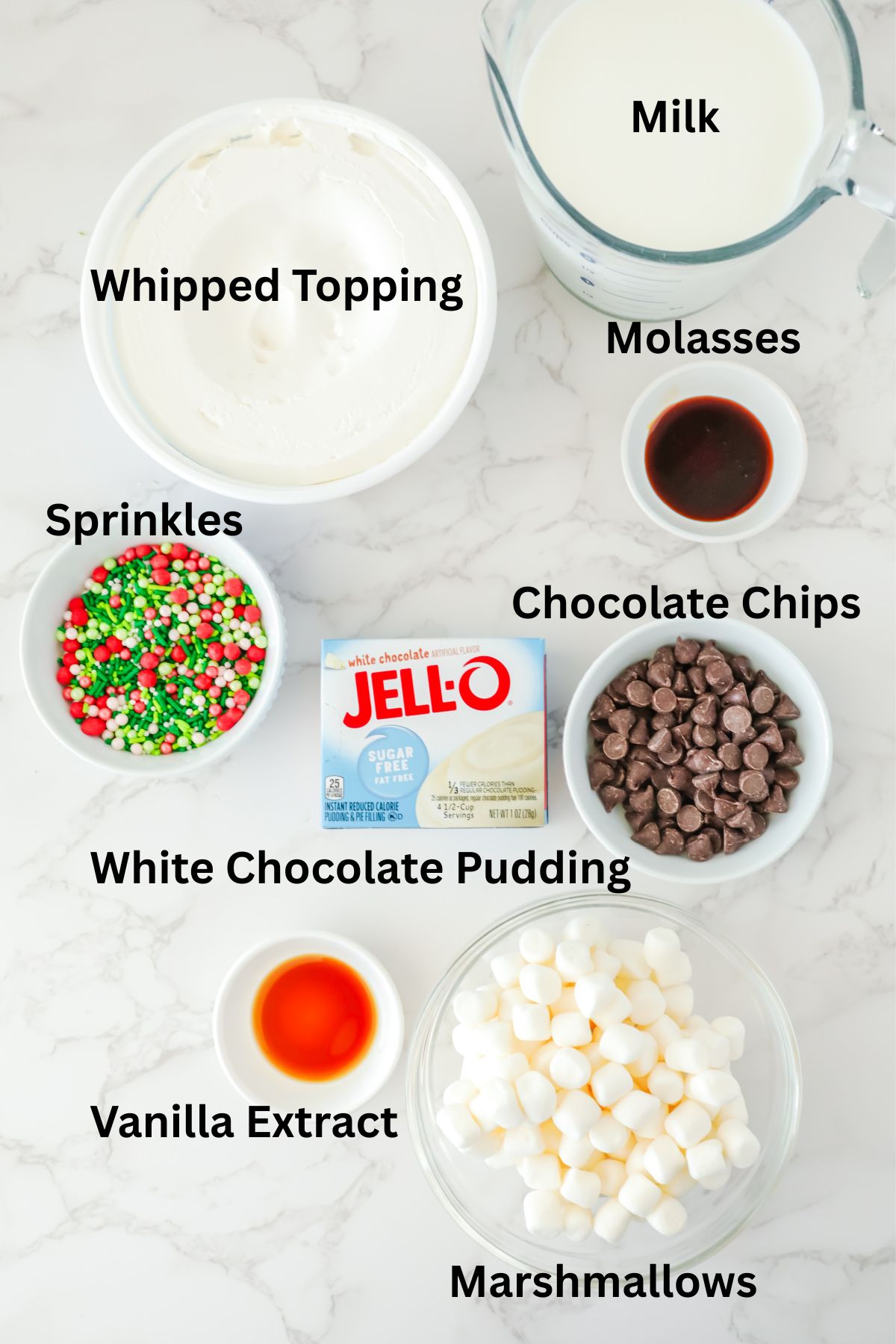 Ingredients to make this fluff in bowls on a table.