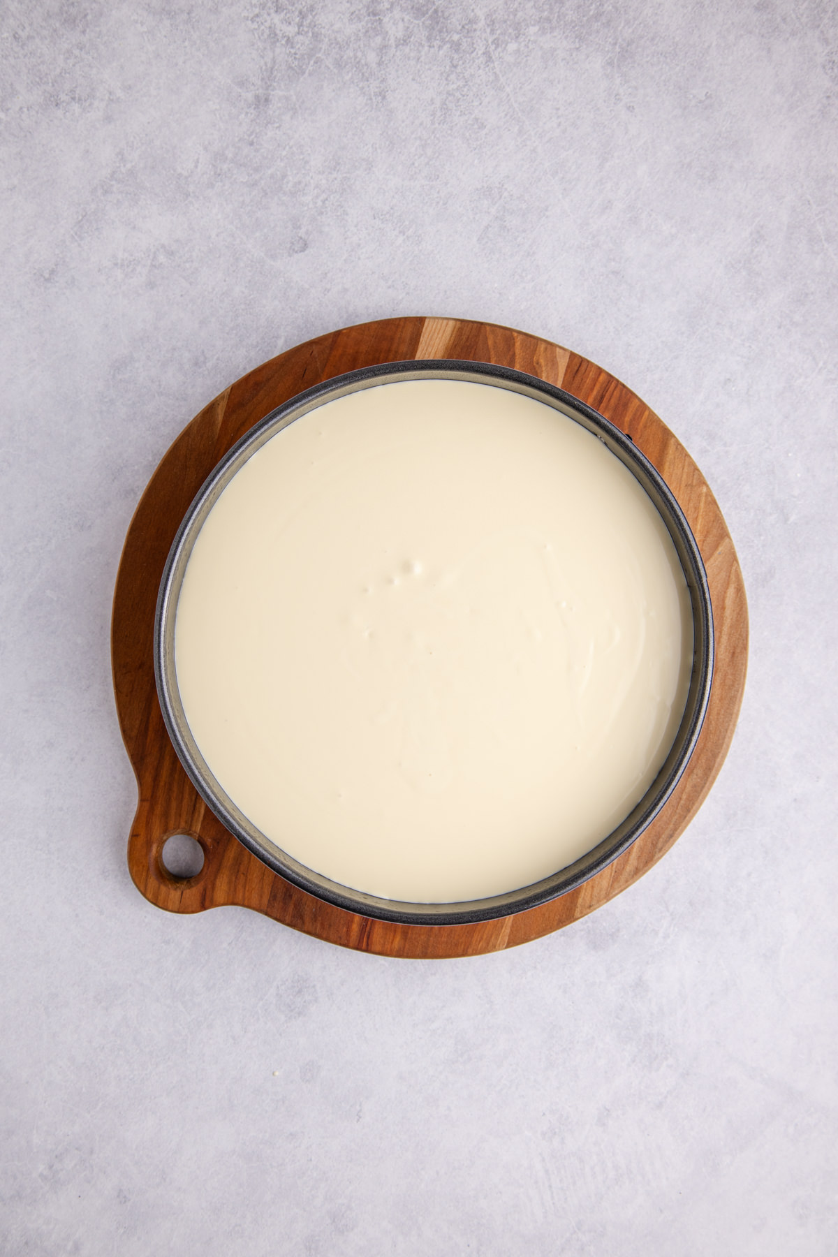 Cream cheese, sugar, cornstarch, Baileys, cream, and eggs combined and added over the crust.