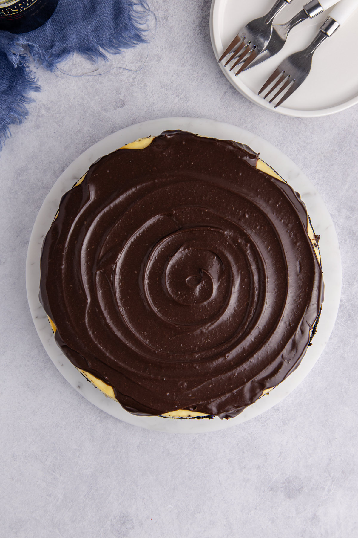 Chocolate poured over top of the cheesecake.